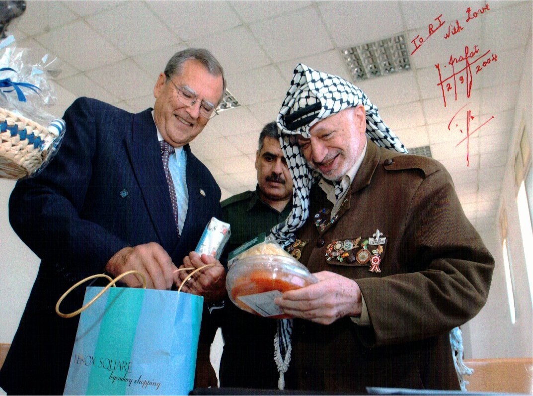R.T. presents President Arafat with gifts for his 75th birthday.